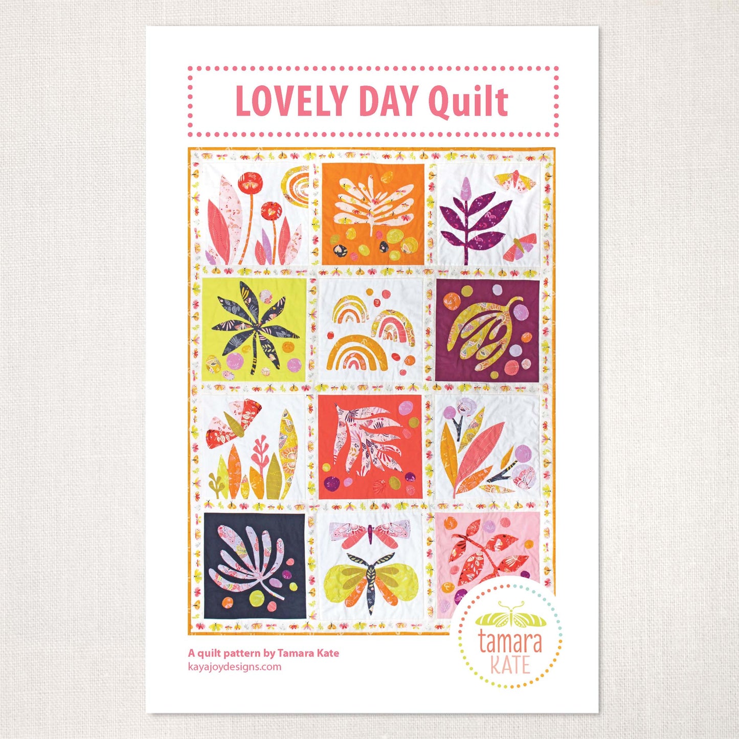 a quilt pattern cover showing 12 blocks of colourful leaves and butterflies