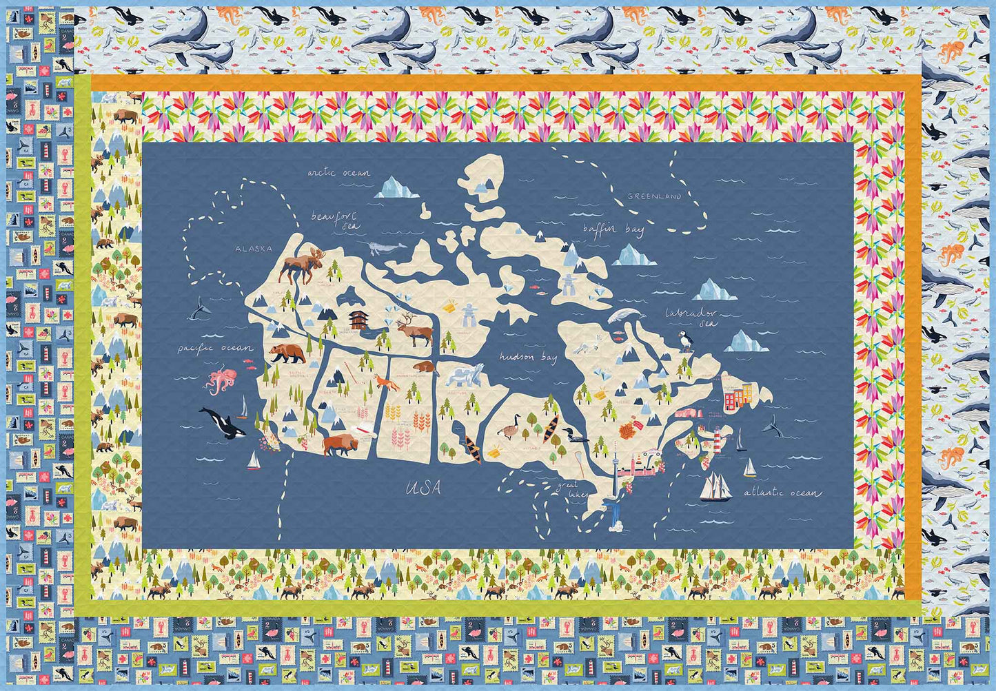 rectangle quilt of a map of Canada fabric with frames of patterned fabrics in blues and neutrals