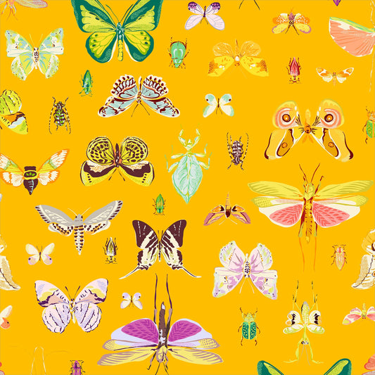 illustrations of butterflies, beetles and other insects in greens, purples, coral, grey and gold on a rich amber ground, printed on fabric