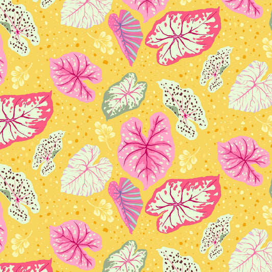 tropical leaves in pinks, dusty green and cream on a yellow ground with spots, printed on fabric