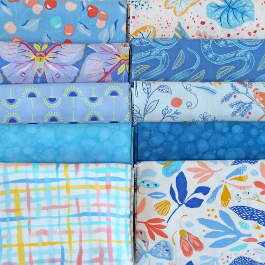 Collection of blue fabric swatches with different patterns.