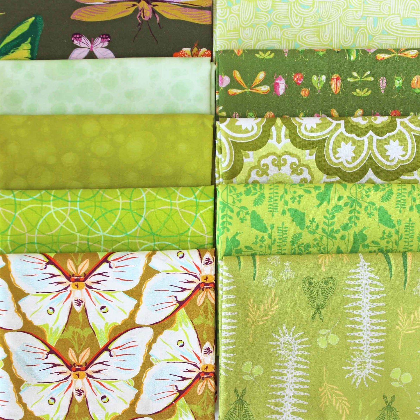 Collection of yellow-green fabric swatches with various patterns