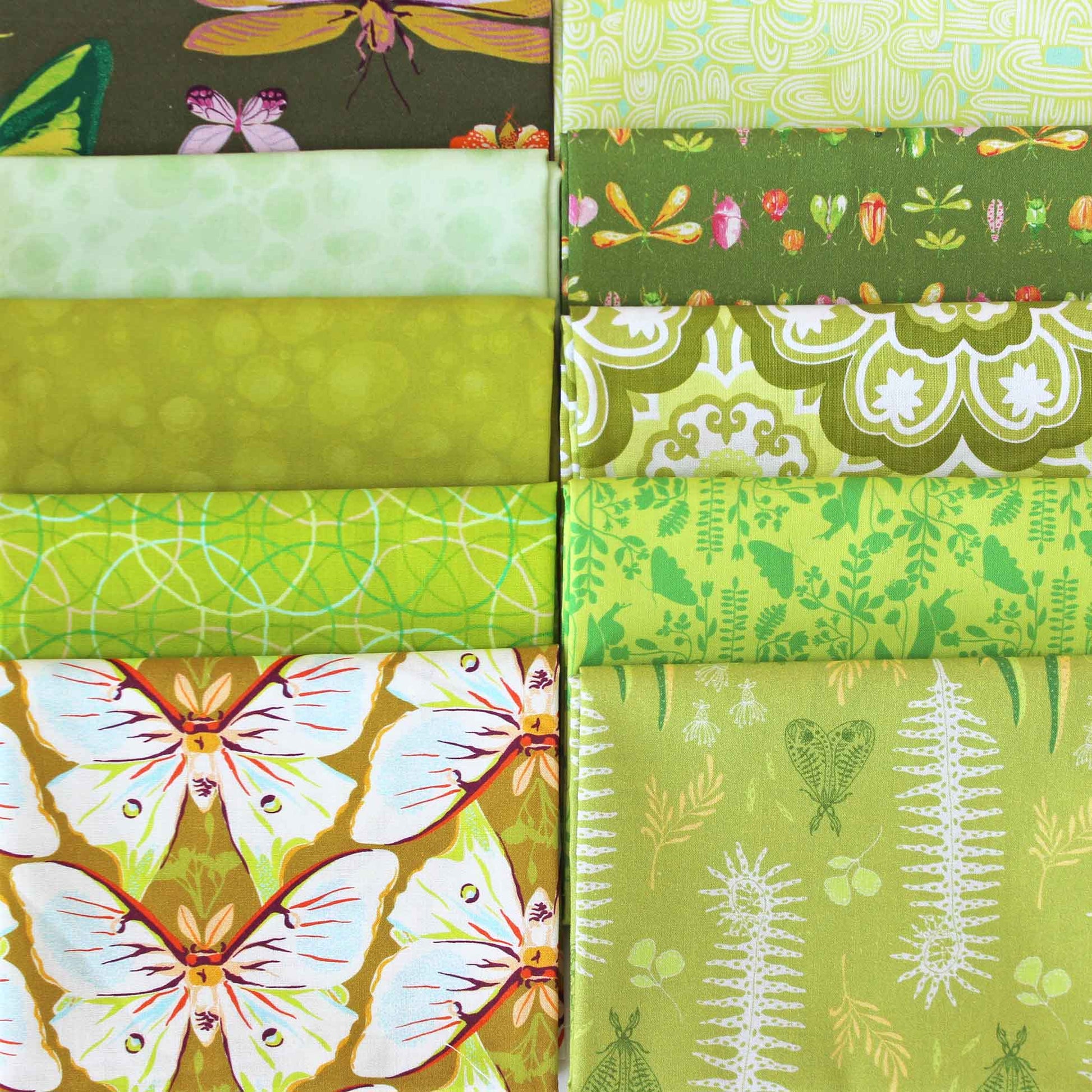 Collection of yellow-green fabric swatches with various patterns