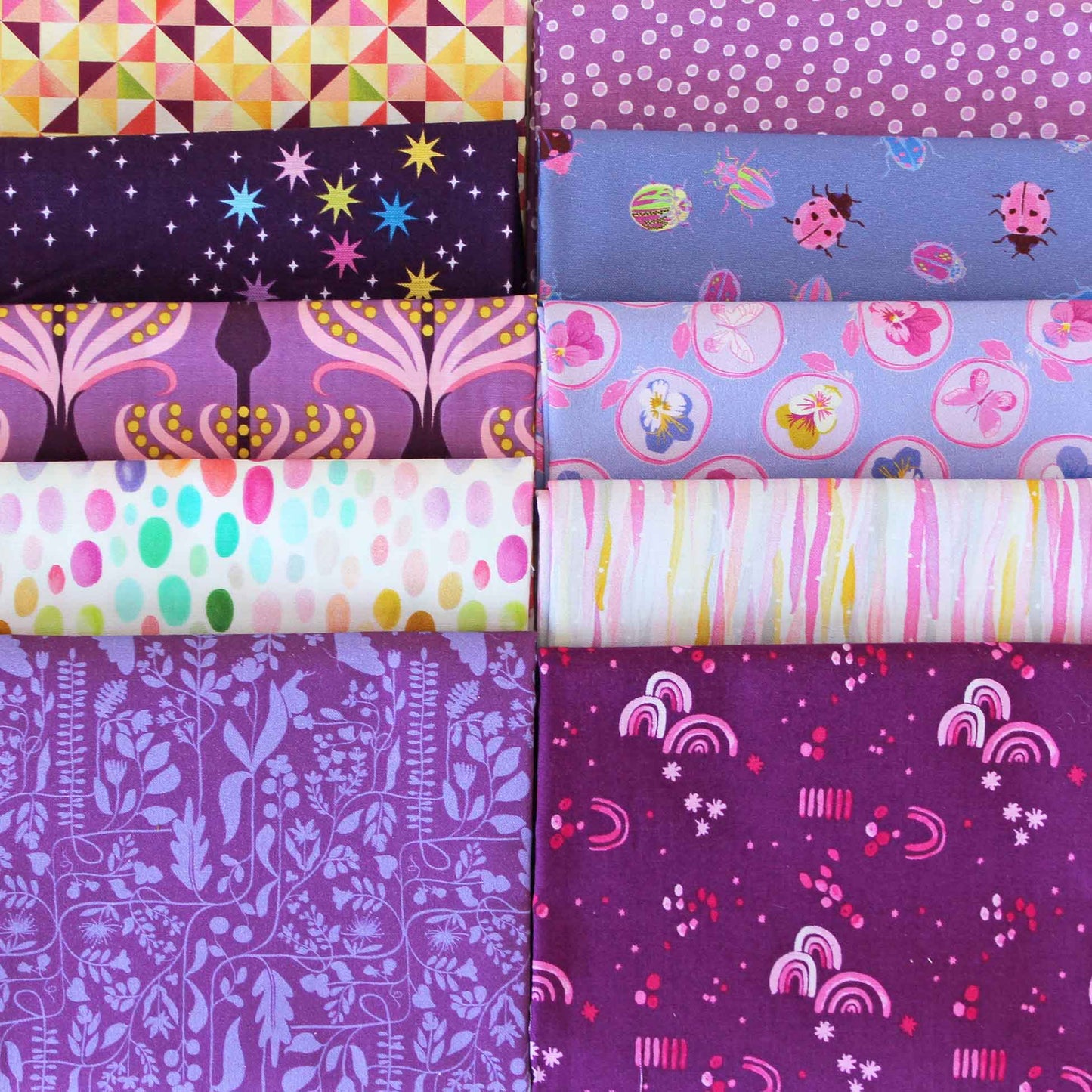 Collection of purple fabric swatches with various patterns