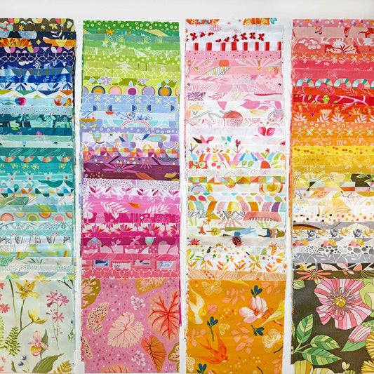 squares of fabrics in a rainbow of colours arranged in straight lines