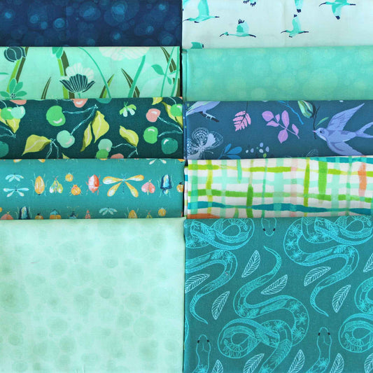 Collection of teal fabric swatches with various patterns