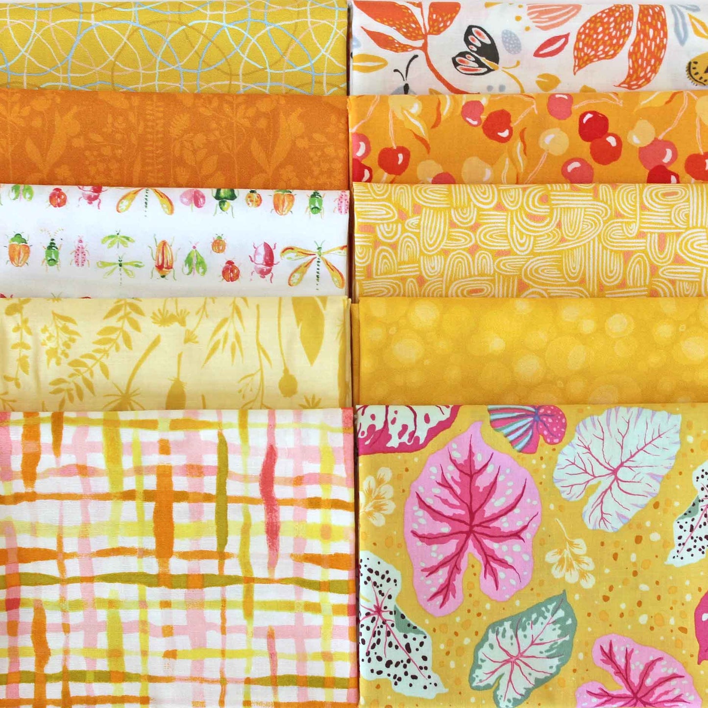Collection of yellow fabric swatches with various patterns