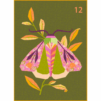 quilt of a large moth in oranges, pinks, and greens