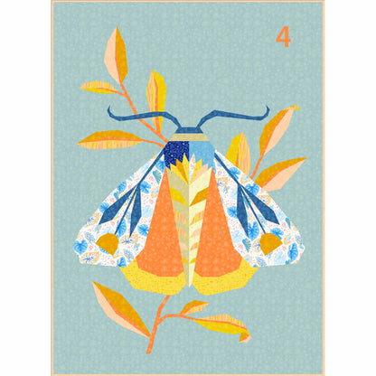 quilt of a large moth in oranges, blues, and yellows