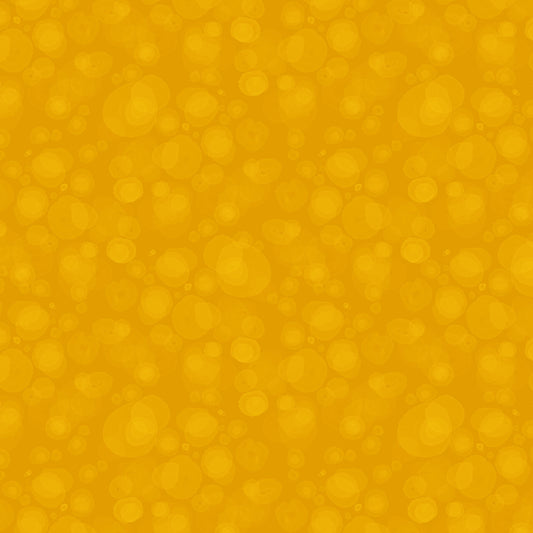 fabric with subtle watercolour spots in deep yellow-gold